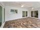 Covered patio features brick pavers, a ceiling fan, and multiple sliding glass doors at 3079 Osprey Ln, Clearwater, FL 33762