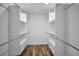 Organized walk-in closet with built-in shelving and ample storage space at 3079 Osprey Ln, Clearwater, FL 33762