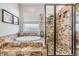 Bathroom featuring a soaking tub and walk-in shower with decorative tile and a frameless glass enclosure at 30817 Pumpkin Ridge Dr, Wesley Chapel, FL 33543