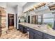 Bathroom featuring a double vanity with framed mirror, decorative lighting, soaking tub and luxurious walk-in shower at 30817 Pumpkin Ridge Dr, Wesley Chapel, FL 33543