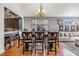 Cozy dining area showcasing hardwood floors, a stylish chandelier, and comfortable seating, perfect for Gathering meals at 30817 Pumpkin Ridge Dr, Wesley Chapel, FL 33543