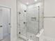 Bathroom featuring glass shower with floor to ceiling marble-like tile at 3101 4Th N Ter, St Petersburg, FL 33713