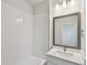 Bright bathroom featuring subway tile and a vanity mirror at 3101 4Th N Ter, St Petersburg, FL 33713