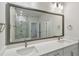 Bright bathroom featuring double sinks and a large vanity mirror at 3101 4Th N Ter, St Petersburg, FL 33713