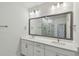 Bright bathroom featuring double sinks and a large vanity mirror at 3101 4Th N Ter, St Petersburg, FL 33713