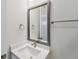 A clean bathroom features a modern sink with a square mirror and stylish fixtures at 3101 4Th N Ter, St Petersburg, FL 33713