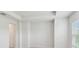 Bright bedroom with neutral carpet, white walls, tray ceiling, and a window at 3101 4Th N Ter, St Petersburg, FL 33713