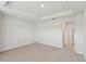 Spacious bedroom features neutral carpet, a tray ceiling, and ample natural light at 3101 4Th N Ter, St Petersburg, FL 33713