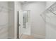 Walk-in closet leading into the bathroom featuring wire shelving at 3101 4Th N Ter, St Petersburg, FL 33713