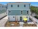 Inviting two-story home with charming patio, yellow umbrella and manicured landscaping at 3101 4Th N Ter, St Petersburg, FL 33713