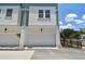 Exterior view of a single-car garage with white door and well-maintained landscaping at 3101 4Th N Ter, St Petersburg, FL 33713