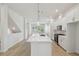 Bright, open kitchen features a large island, stainless steel appliances, and white cabinetry at 3101 4Th N Ter, St Petersburg, FL 33713