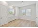 Well-lit room with white cabinets, countertop, and two windows with views and natural light at 3101 4Th N Ter, St Petersburg, FL 33713