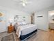 Bedroom features wood floors and an ensuite bathroom at 35149 Wagner Way, Zephyrhills, FL 33541