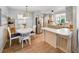 Charming kitchen with modern appliances, seamlessly connecting to the adjacent dining area at 35149 Wagner Way, Zephyrhills, FL 33541