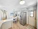 The eat-in kitchen features stainless steel appliances, a breakfast bar and an adjacent dining area at 35149 Wagner Way, Zephyrhills, FL 33541