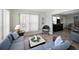 Inviting living area with cozy seating, perfect for relaxation and entertaining guests in comfort at 35149 Wagner Way, Zephyrhills, FL 33541