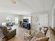Inviting living room featuring contemporary decor, neutral tones, and seamless access to other rooms at 35149 Wagner Way, Zephyrhills, FL 33541