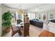 Open concept living and dining area with ample natural light, perfect for comfortable living and entertaining at 35149 Wagner Way, Zephyrhills, FL 33541