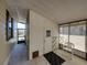 View of the enclosed patio with seating, table, and exit to the outside at 35149 Wagner Way, Zephyrhills, FL 33541
