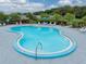 Bright community pool offers an inviting place to cool off, with plenty of lounge seating surrounding at 35149 Wagner Way, Zephyrhills, FL 33541