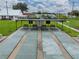 Enjoy shuffleboard on the community's well-maintained courts, complete with seating and scoreboards under a shaded covering at 35149 Wagner Way, Zephyrhills, FL 33541