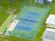 Aerial view of a well-maintained tennis court perfect for enjoying a match on a sunny day at 35149 Wagner Way, Zephyrhills, FL 33541