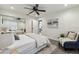 Bright bedroom featuring a chair, closet with mirrored doors, neutral color scheme, and wood-look floors at 3806 N Tampa St, Tampa, FL 33603