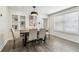 Elegant dining room featuring a stylish light fixture, modern decor, and hardwood floors at 3806 N Tampa St, Tampa, FL 33603