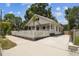 Charming home with a white picket fence, beautiful green plants, and inviting curb appeal at 3806 N Tampa St, Tampa, FL 33603