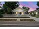 Charming home with a white picket fence, manicured lawn, and welcoming front porch at 3806 N Tampa St, Tampa, FL 33603