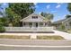 Charming home with a white picket fence, manicured lawn, and welcoming front porch at 3806 N Tampa St, Tampa, FL 33603