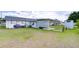 Spacious backyard shows the patio with dining area, and room for outdoor enjoyment at 39423 9Th Ave, Zephyrhills, FL 33542