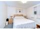Well-lit bedroom features two windows, neutral colored walls, and two bedside tables with lamps at 39423 9Th Ave, Zephyrhills, FL 33542