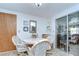 Bright dining area with tile flooring, table and chairs, and a sliding glass door at 39423 9Th Ave, Zephyrhills, FL 33542