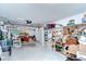 Spacious two car garage space with pegboard and disorganized furnishings at 39423 9Th Ave, Zephyrhills, FL 33542
