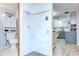 Hallway looking into updated kitchen and powder room at 39423 9Th Ave, Zephyrhills, FL 33542