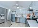 Updated kitchen featuring stainless appliances, white subway tile backsplash, and tile floors at 39423 9Th Ave, Zephyrhills, FL 33542