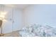 Cozy living room features plush sofa, a lamp, and a bright white door at 39423 9Th Ave, Zephyrhills, FL 33542