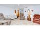 Charming living room with tile floors, ceiling fan, and comfortable furnishings at 39423 9Th Ave, Zephyrhills, FL 33542