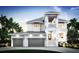 Stunning two-story home featuring a two car garage, private balcony, and lush landscaping at 4 W Spanish Main St, Tampa, FL 33609
