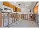 Bright kitchen features studs, concrete block, terrazzo floor, and wooden cabinets at 4465 1St Ne Way, St Petersburg, FL 33703