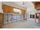 Bright kitchen features studs, concrete block, terrazzo floor, wooden cabinets, and door to the yard at 4465 1St Ne Way, St Petersburg, FL 33703