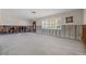 Light-filled living room features studs, concrete block, terrazzo floor, and exterior access at 4465 1St Ne Way, St Petersburg, FL 33703