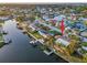 An elevated perspective of the home with a large waterfront, private dock and lush tropical landscaping at 4772 Dover Ne St, St Petersburg, FL 33703