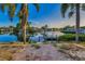 Waterfront backyard featuring a patio, and a private dock on a tranquil waterway at 4772 Dover Ne St, St Petersburg, FL 33703