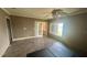 Spacious bedroom featuring updated flooring, bright windows, and a ceiling fan at 4772 Dover Ne St, St Petersburg, FL 33703