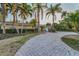 Charming exterior of a lovely single-story home, boasting a brick driveway and well-manicured landscaping at 4772 Dover Ne St, St Petersburg, FL 33703