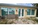 Back exterior of home with water views, a patio, and French doors at 4772 Dover Ne St, St Petersburg, FL 33703