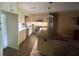 Well-lit kitchen showcasing custom cabinetry, mosaic backsplash, and an island at 4772 Dover Ne St, St Petersburg, FL 33703